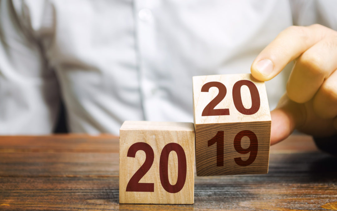 Two wooden blocks with numbers 2019 and 2020